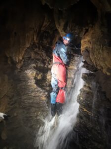 Wet caving adventure, the Mendips, N. Somerset