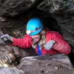 Woman exiting Goatchurch Cavern, the Mendips