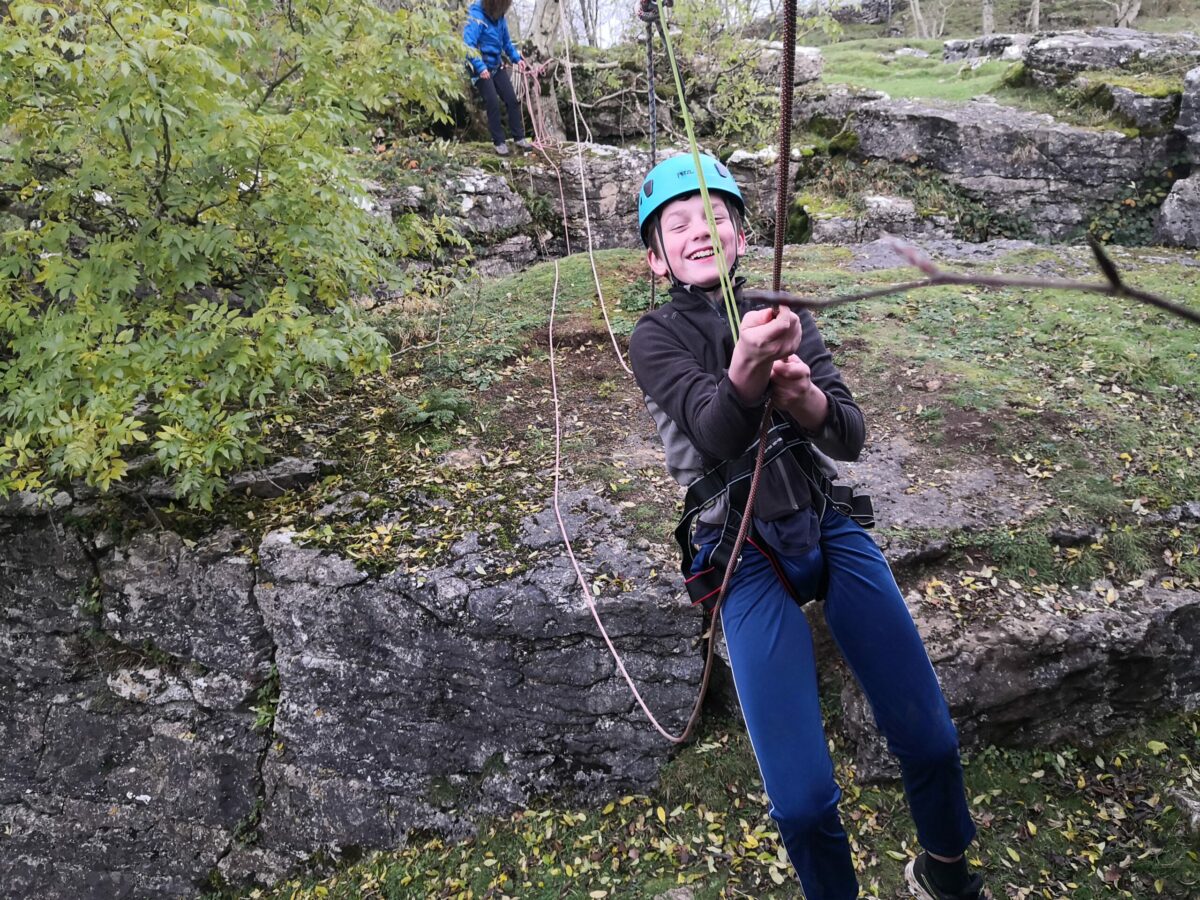 Boy on tyrrolean rope crossing